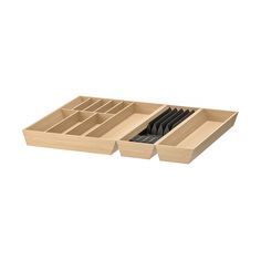 an open drawer with utensils in it