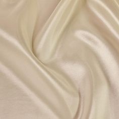 the white fabric is very soft and smooth, but it doesn't look like silk