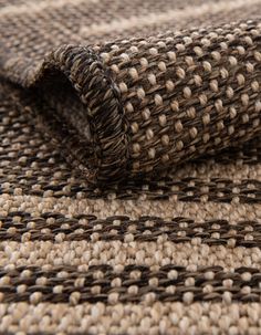 a close up view of the woven material on top of a rug or table cloth