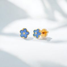 Add a fun and bold twist to your look with these Tiny Stud Earrings adorned with the sweetest blue flowers. Made with hypoallergenic stainless steel posts and 14k gold PVD plating, these earrings are both fun and gentle on sensitive ears. We are in love with this design! 4-5mm Tiny Studs in the sweetest designs Hypoallergenic, 14K Gold Plated Stainless Steel Waterproof, sweat proof, tarnish proof Screw-on, flat backs in the cutest flower design Each pair includes a spare back .9mm gauge + shorte Mother's Day Games, Colorful Stud Earrings, Gold Bracelets Stacked, Small Chandelier, Tiny Studs, Kids Earrings, Tiny Stud Earrings, Extended Family, Novelty Items