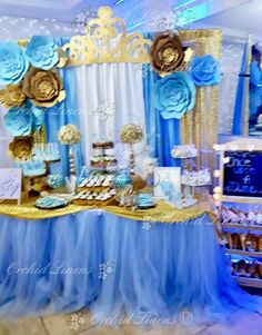 a table with blue and gold decorations on it