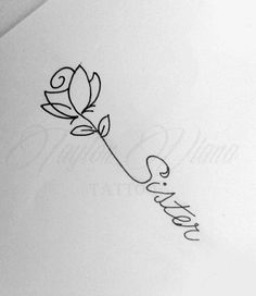 a rose that is on top of a piece of paper with the word love written in cursive writing