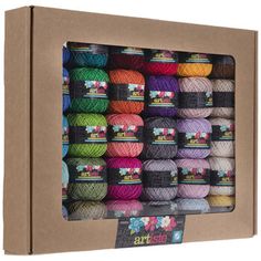 an open cardboard box filled with balls of yarn