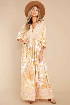 If you need a dress in which you can go to a brunch. get your daily chores done and even meet your friends for a quick dinner... then this is it! This gold print maxi dress features a deep v-neckline. adjustable self ties at the waist and upper back. and buttons down the front. Model is wearing a small. • 100% Polyester • Hand Wash Cold • Unlined • Imported Daily Chores, Sorority Rush Dresses, Rush Dresses, Cardigan Crop Top, Dress Bra, Long Crop Top, Gold Print, Little White Dresses, Quick Dinner