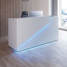 the front desk of an office with a laptop on it's stand and blue lighting