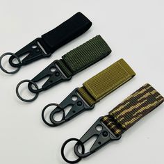 Our tactical Gear Keeper keychain, often referred to as a keychain belt loop or key holder, which is a small accessory designed to attach to your belt, allowing you to secure your keys conveniently. This type of keychain typically features a loop or clip that can be easily threaded through a belt on your pants. The primary purpose is to keep your keys easily accessible and secure, preventing them from getting lost. Our tactical Gear Keeper Features DuroGrip webbing material with hook and loop Velcro. Heavy duty HK Hook with key ring. Easy to use, fits various belt widths, widest support 2 inches waist belt. Velcro enclosure, can be used with any ordinary belt, backpack, or tactical backpack/tactical belt. Specifications: 4.2" in length and 1" in width. Perfect for Outdoor: traveling, hikin Tactical Bag With Adjustable Strap For Outdoor, Black Adjustable Belt With Belt Clip, Functional Nylon Belt Bag For On-the-go, Tactical Keychain, Military Style Bags With Adjustable Strap For Outdoor, Every Day Carry, Tactical Belt, Tactical Backpack, Small Accessories