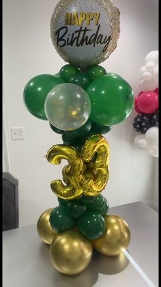 a bunch of balloons that are in the shape of numbers on top of each other