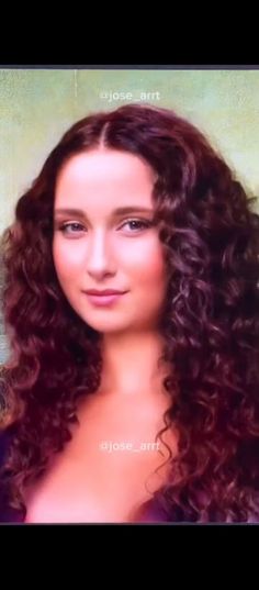 a woman with long curly hair and blue eyes