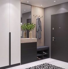 a bathroom with a black and white rug on the floor next to a shower stall