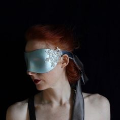 Because discipline doesn't always to be about hardware and heavy handedness. This luxury hand molded leather blindfold is formed in the Coquette style and stained in Pearly Serenity blue. Vintage lace flowers are beaded and adorn the sides of the mask, where long, sumptuous ties of charmeuse silk flow to tie the mask securely round the back of the head. The back of the mask is lined in charmeuse silk, so it feels soft against the face. It is light and comfortable to wear all evening long, for pl Serenity Blue, Hand Molding, Lace Flowers, Beaded Lace, Silk Ties, Vintage Lace, Blue Leather, Pear, Gift For Lover