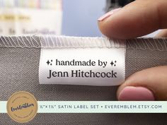 a person holding onto a label that says handmade by jean hitchcock