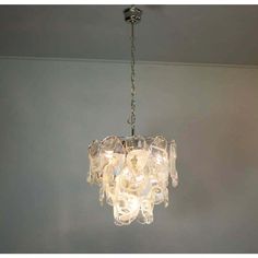 a glass chandelier hanging from the ceiling