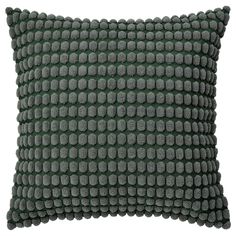 a green and grey pillow on a white background