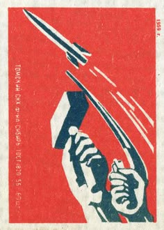 a red and blue postage stamp with a hand holding a knife in the air above it