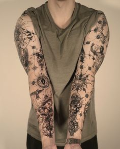 a man with many tattoos on his arms