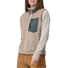 evo.com | Patagonia Vests > The Patagonia Classic Retro-X® Vest is a classic for a reason. Made from fuzzy and warm bonded shearling fleece, it's the cozy layering piece your wardrobe has been missing. Throw it over your favorite shirt or sweater and prepare yourself for endless compliments. Vertical Zippered Nylon Chest Pocket Regular Fit Neither slim nor oversized. Regular-fitting technical garments may be worn over heavier midlayers. Full Front Zip w/ Internal Wind Flap Fleece 12.9 oz 100% Po Patagonia Vest Outfit, Vest Patagonia, Patagonia Retro X, Patagonia Vest, Womens Outdoor Clothing, Vest Outfit, Layered Shirts, Vest Outfits, Fleece Vest