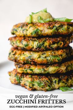 a stack of zucchini fritters sitting on top of a white plate