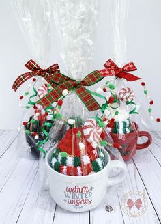 a mug filled with candy canes and candies for women to give as gifts