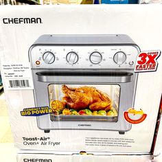 an oven with the lid open on display for sale in a grocery store's showroom