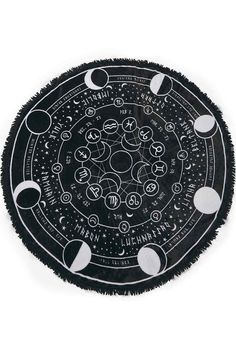 a black and white drawing of the solar system on a circular surface with stars, moon phases