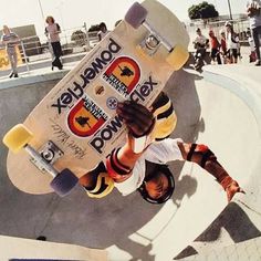 a skateboarder doing tricks at a skate park