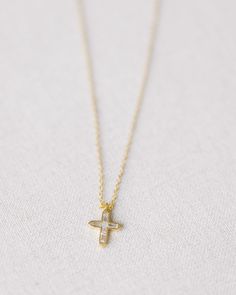 This Gold Crystal Cross Necklace is crafted with gold vermeil and features a crystal cross. With timeless elegance and sparkling beauty, this necklace is a classic piece. measures 18.5" at longest, 16.5" at shortest Yellow Gold Cross Necklace With Delicate Chain, Delicate Gold Cross Pendant Necklace, Gold Sterling Silver Cross Necklace For Anniversary, Gold Cross Pendant Necklace For Anniversary, Gold Cross Necklace With Delicate Chain In Sterling Silver, Delicate Gold Cross Jewelry, Delicate Yellow Gold Cross Pendant Necklace, Dainty Gold Cross Necklace For Anniversary, Dainty Gold Sterling Silver Cross Necklace