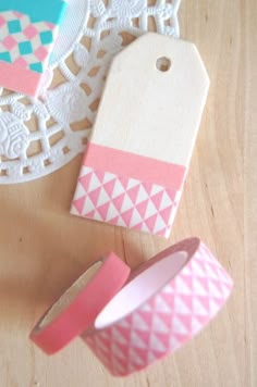 two washi tapes, one pink and the other blue are sitting on a table