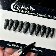 Welcome to LD Nails! 🖤 One set of 10 REUSABLE Press On Nails 🖤 🖤 Made to order in your shape & size 🖤 🕸️ Black on Black: Webs. Matte black press on nails with glossy black spider web detailing Purchase INCLUDES an application kit! It consists of: 🖤 detailed application & removal instructions 🖤 a sealed and sanitary mani kit (100/180 file, buffer block, cuticle pusher) 🖤 2 alcohol pads 🖤 nail tabs or glue (glue is standard, request tabs in the personalization box if you prefer them!) *Only one kit is sent per order. Extra kits and kit contents can be picked up here 👉 https://www.etsy.com/ca/listing/817160463/application-kit-press-on-nails-gothic Est. 2020: LD Nails specializes in custom Gothic, Witchy and Alternative Press On Nails. I draw inspiration from what I love, so you’ll f Spiderweb Nails, Nails Witchy, Black Press On Nails, Nails Gothic, Alcohol Pads, Witchy Nails, Nails Glossy, Gothic Nails, Web Detail