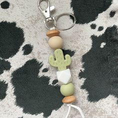 a keychain made out of beads with a cactus on it