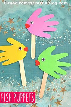 three hand puppets made out of popsicle sticks with the words fish puppets on them