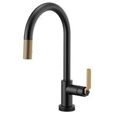 the black faucet with gold handles is shown in front of a white background