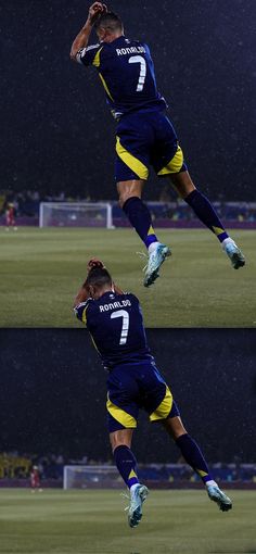 two soccer players jumping up in the air to catch a ball during a rain storm