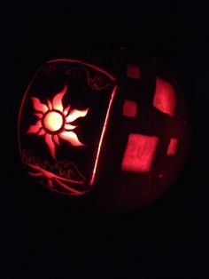 a pumpkin carved to look like it is lit up