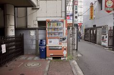 a vending machine on the side of a street