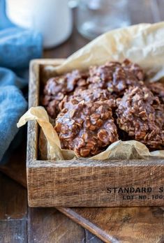 a wooden box filled with chocolate granola cookies