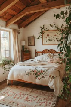 a bed sitting under a window in a bedroom next to a rug and potted plant