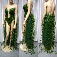 the mannequin is covered in green ivy