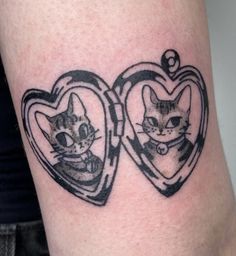 two heart shaped tattoos with cats in them