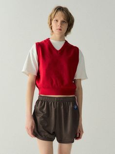 This is cute cropped vest simply accented with logo embroidery under armhole. Style yours layering over t-shirt or shirts.- V-neck - Logo embroidery- Ribbed edges- Semi-cropped length- Sleeveless- Relaxed fit Red Cotton V-neck Crop Top, Red V-neck Cotton Crop Top, Red V-neck Cotton Vest, Casual Red V-neck Vest, Red Cotton Vest Top, Red Cotton Casual Sweater Vest, Casual Red Crew Neck Vest, Casual Red Cotton Sweater Vest, V Neck Vest Outfit