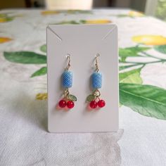 Gold Dangle Earrings Feature Red Cherry Charms And Unique, Baby Blue, Quilt Patterned Czech Glass Beads With French Ball Ear Hooks. Also Available As A Set Approximately 1.6 Inch Drop Silicone Stoppers Included Ships Within 2 Business Days Customization Available Made To Order Made With Love And Care Cherry Earrings, Unique Czech Glass Blue Quilt Cottagecore Casual Fun Earrings / Novelty Earrings, Aesthetic, Retro, Dainty, Cool, Bead, Beaded, Gift, Neutral, Fruit, Daily Wear, Everyday Wear, Boho Quilt Cottagecore, Novelty Earrings, Blue Quilt, Earrings Aesthetic, Cherry Earrings, Aesthetic Retro, Gold Dangle Earrings, Red Cherry, Summer Earring