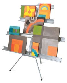 an easel with multiple paintings on it