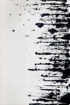 an abstract black and white painting with paint splattered on it's surface