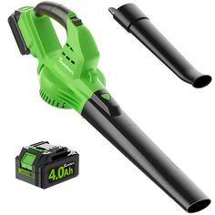 a green and black blow dryer next to a battery