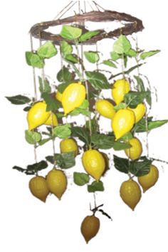 a mobile with lemons and leaves hanging from it