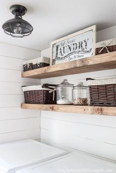 the shelves above the washer are filled with laundry items