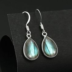 Natural Labradorite Earrings, Labradorite Earrings, 925 Silver Earrings, Lebradorite Jewellery, Teardrop solid Silver Earring, for her Metal :- 925 Sterling Silver (Stamp on the Product) Gemstone - Labradorite  Weight - 4.5gm Stone Size - 10x14mm Setting - Bezel """"The Product you will receive may vary from the image as no two gemstone are similar and images cannot define exact product definitions. """" Labradorite Earrings, Labradorite Jewelry, 925 Silver Earrings, Silver Earring, Sterling Silber, Labradorite, Jewelry Earrings Dangle, Silver Earrings, 925 Silver