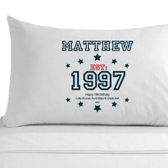 a white pillow with the name and date of birth printed on it