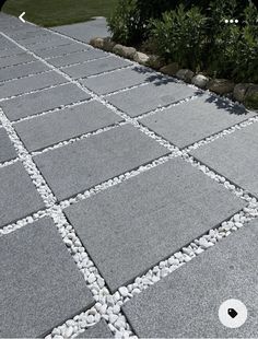 a walkway made out of stones and gravel