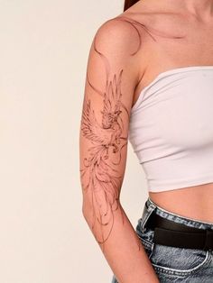 a woman with a bird tattoo on her left arm and right arm behind her back