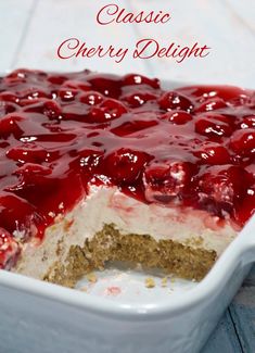 a close up of a cake in a pan with cherries on top and the words classic cherry delight